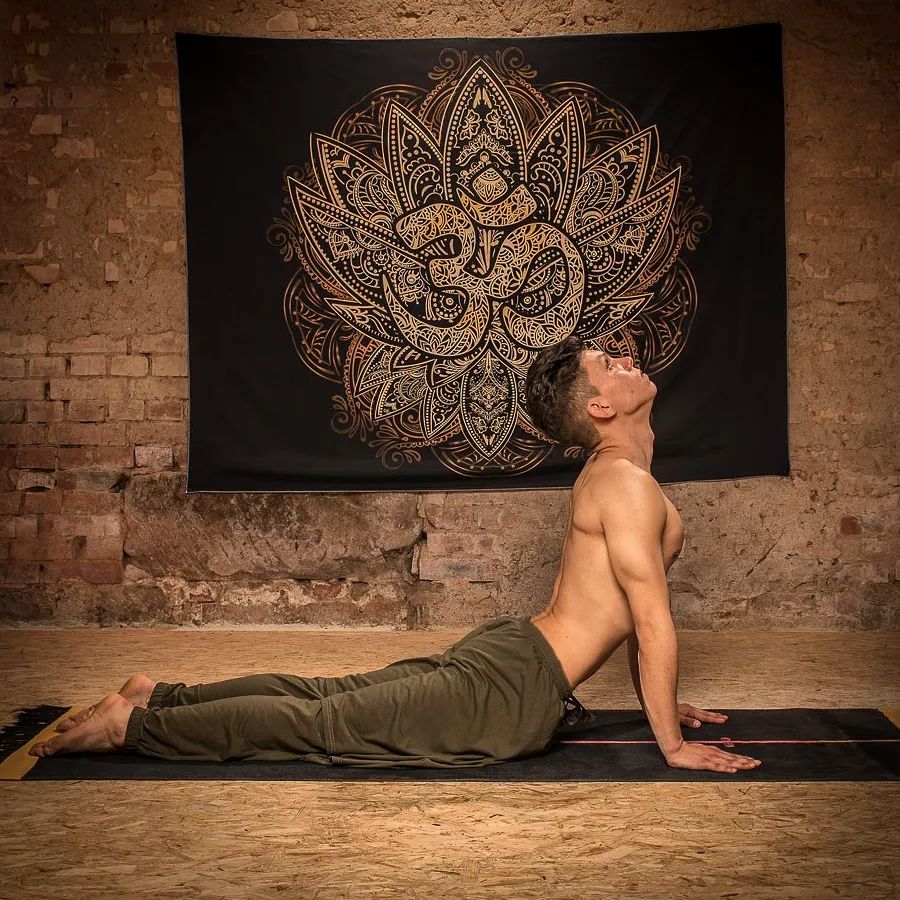 A man doing the cobra yoga pose