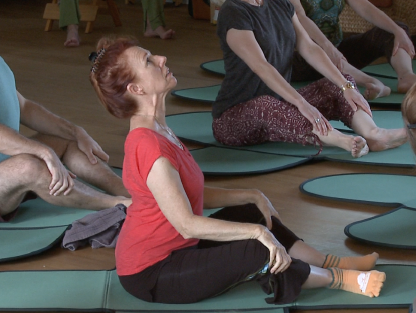 Elderly person doing Gyrokinesis