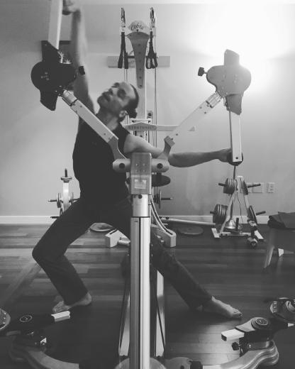 Client working out using the GYROTONIC Gyrotoner